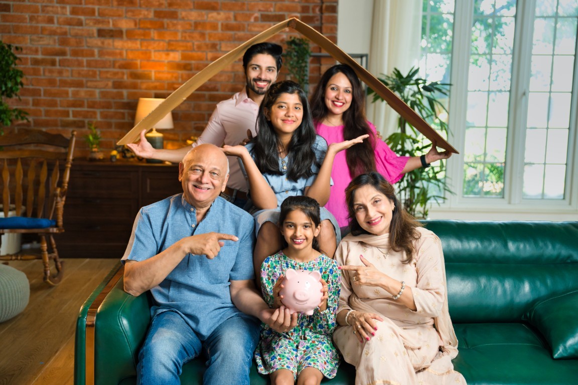 Happy family covered by insurance